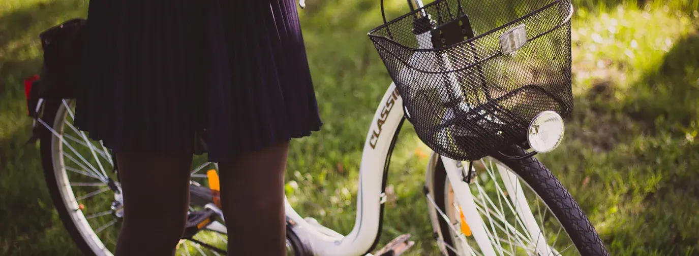 woman holding a bike